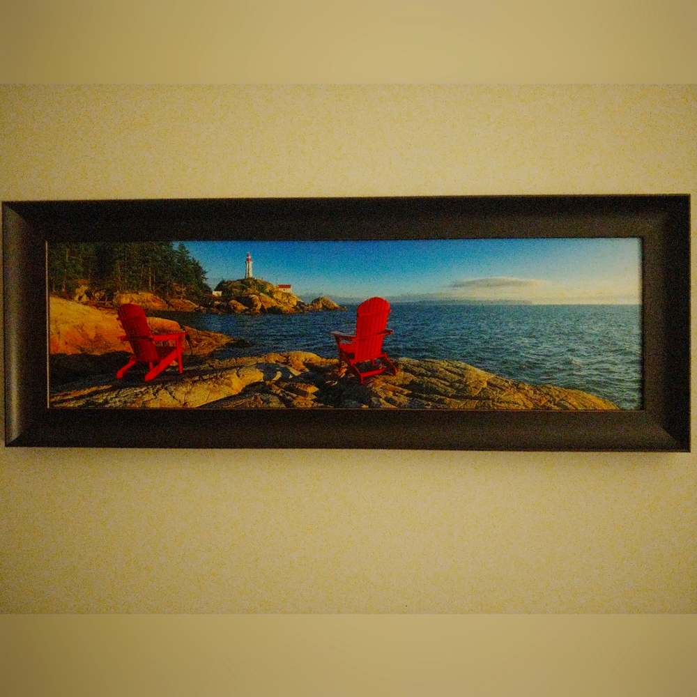Laminated and framed print - chairs by the lake